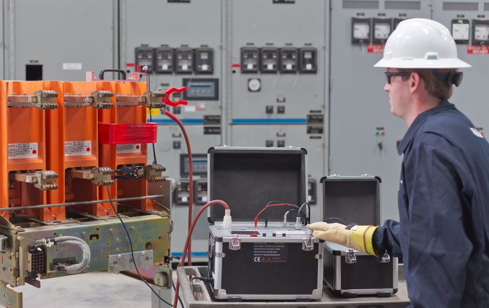Technician testing vacuum interrupters with MAC-TS4